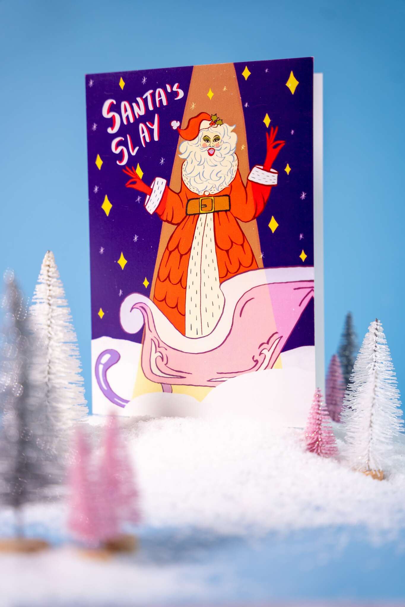 Card with Santa Claus illustration and 'Santa's Slay' text against a snowy landscape.